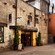 The weathered brick façade of the Old Jameson Distillery’s main entrance